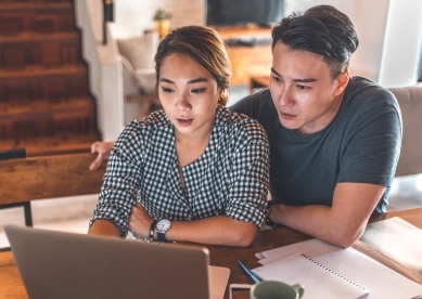 Couple looking at laptop